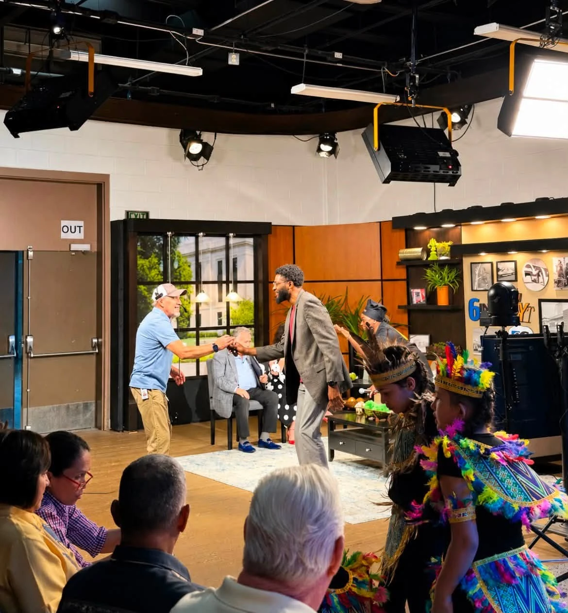 Deswick Bonds Jr. greeting guests on a studio set